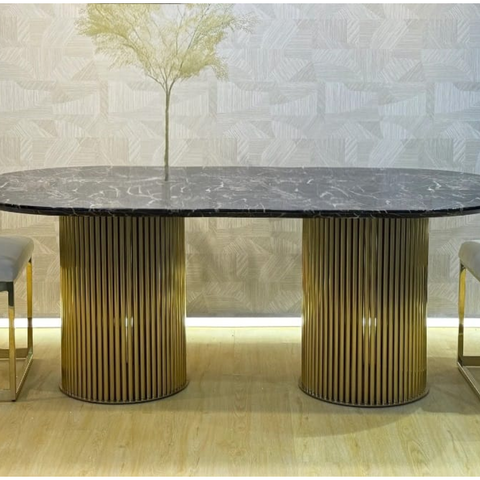 Arshie Oval Pedestal Dining Table with black marble-look sintered stone top and polished gold fluted pedestal base