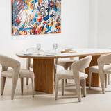 Lucerne dining table showing sculptural crescent pedestal design and open legroom
