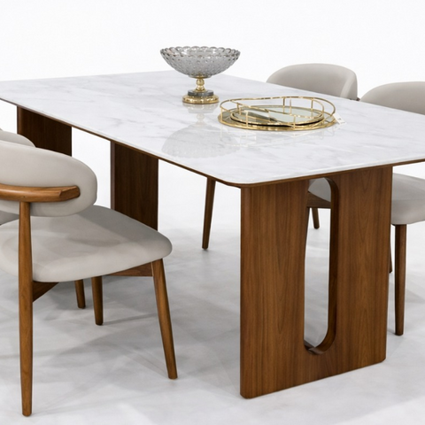 The Slot Sintered Dining Table with white marble-look stone top and walnut pedestal legs with oval cutouts